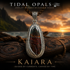 Kaiara Australian Boulder Opal pendant featuring a natural 30 × 12 mm Australian Boulder Opal with brilliant blue and green color play in a handcrafted sterling silver setting with flowing Polynesian-inspired engraving.