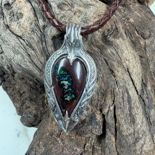 Artisan sterling silver pendant showcasing a natural Australian Boulder Opal with emerald green, cobalt blue, and mahogany ironstone.