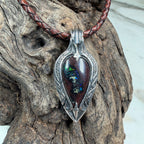 Collector-quality Australian Boulder Opal pendant with rich mahogany ironstone and intricate hand-engraved sterling silver details.