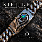 Riptide silver Cuban-link bracelet with sculpted wave details and a round blue-green Lightning Ridge opal

