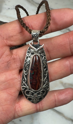 Artisan sterling silver pendant with genuine Australian Boulder Opal and Pacific-inspired design.