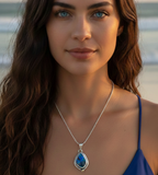 Woman wearing a blue pendant necklace 