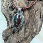 Handcrafted .925 sterling silver pendant featuring a vibrant Australian Boulder Opal with emerald green, cobalt blue, teal, and cream natural matrix.