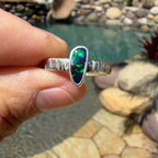 Handmade Australian Boulder Opal ring with green, blue and turquoise color in a simple silver setting.