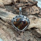 Sea Forge Australian Boulder Opal Pendant handcrafted in sterling silver featuring a genuine 20 × 24 mm Boulder Opal with brilliant blue, green, turquoise, and copper flashes.