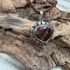 Sea Forge Australian Boulder Opal Pendant handcrafted in sterling silver featuring a genuine 20 × 24 mm Boulder Opal with brilliant blue, green, turquoise, and copper flashes.