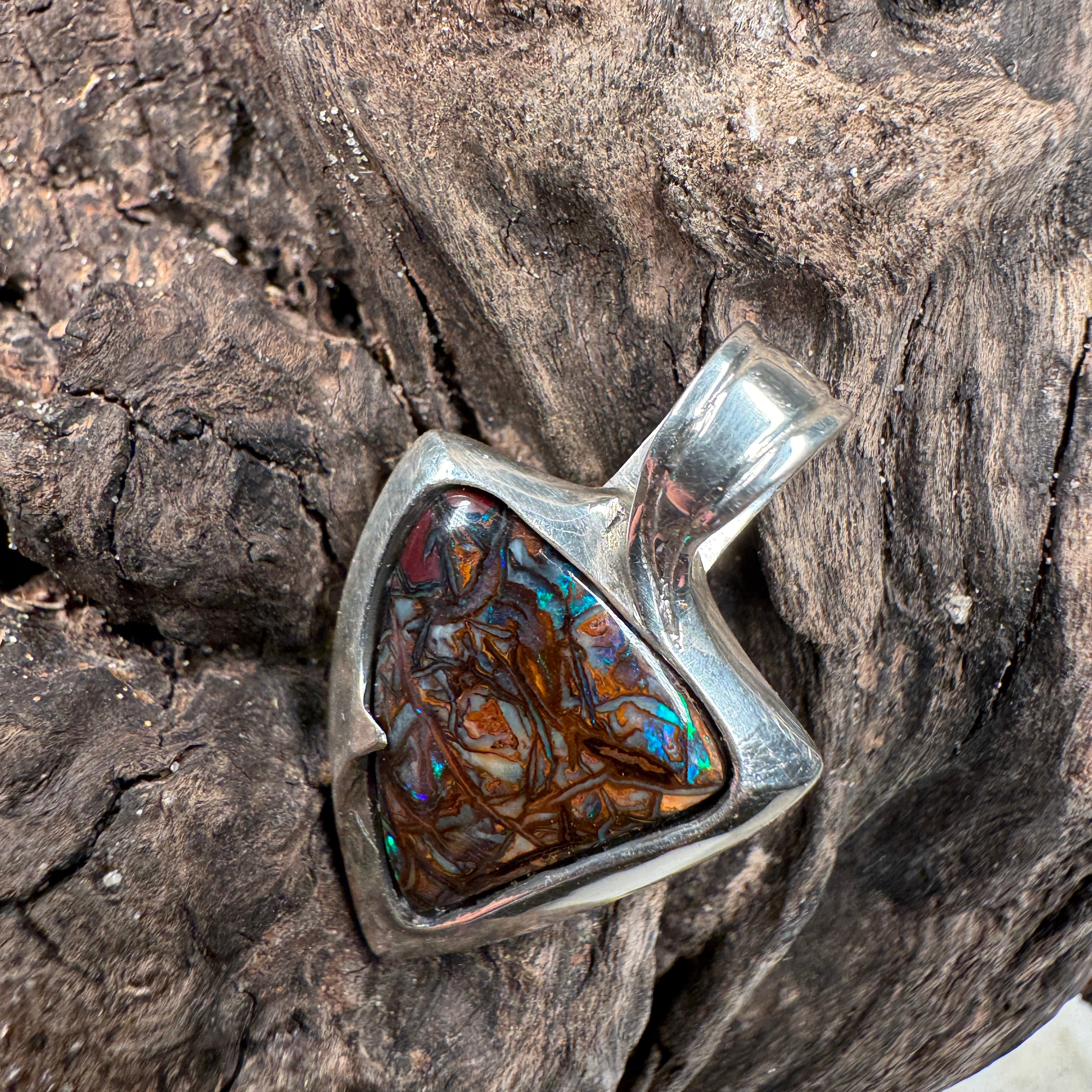 boulder opal pendant with natural green vein patterns