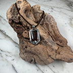 Ember Current Australian Boulder Opal shield pendant featuring vibrant green and blue fire in a handcrafted sterling silver setting by TIDAL OPALS.