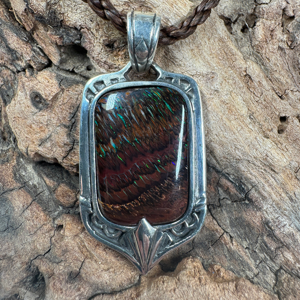 Ember Current Australian Boulder Opal shield pendant featuring vibrant green and blue fire in a handcrafted sterling silver setting by TIDAL OPALS.