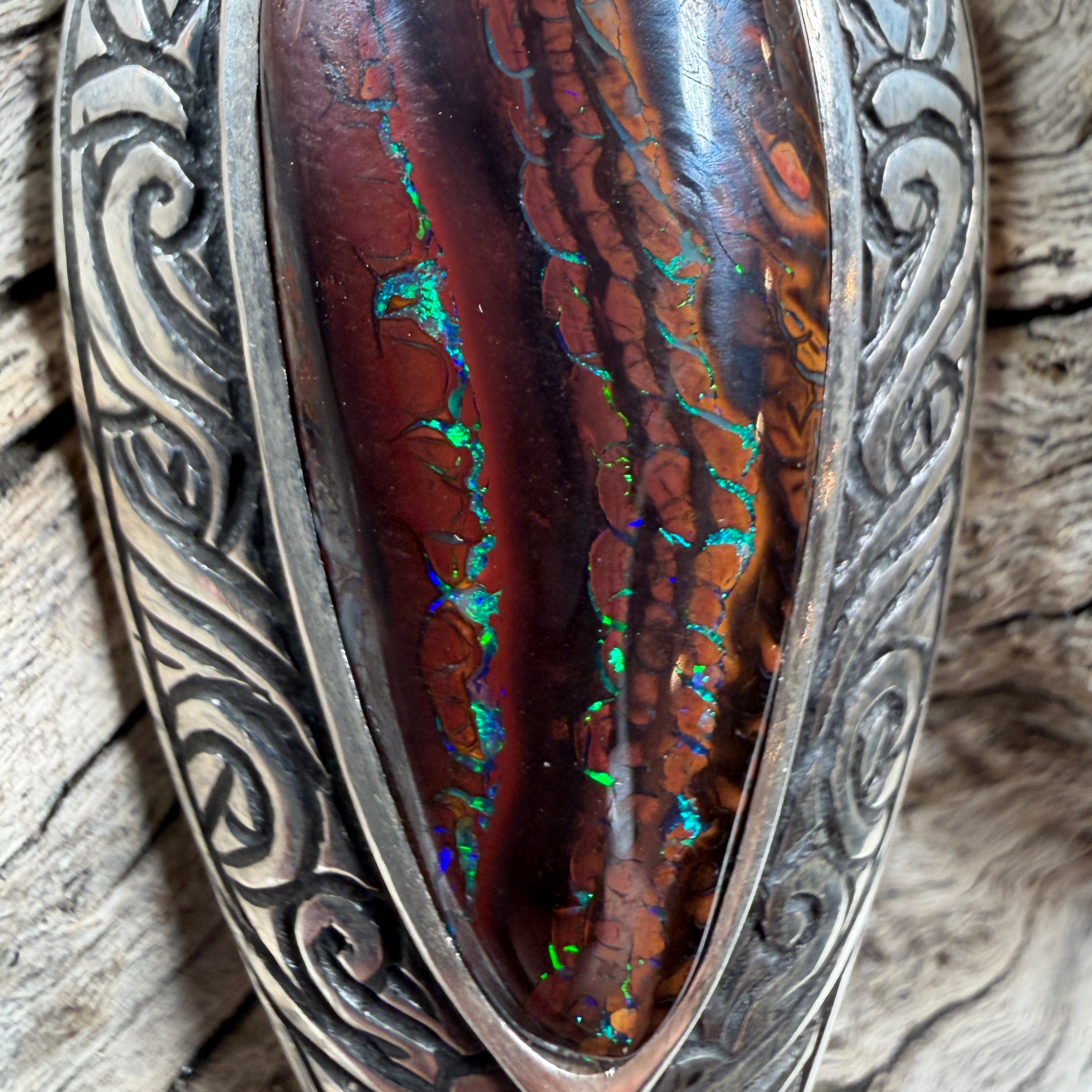Tidal Koru Relic Boulder Opal Pendant, a one-of-a-kind boulder opal pendant inspired by the ancient Koru symbol of renewal, growth, and eternal movement.