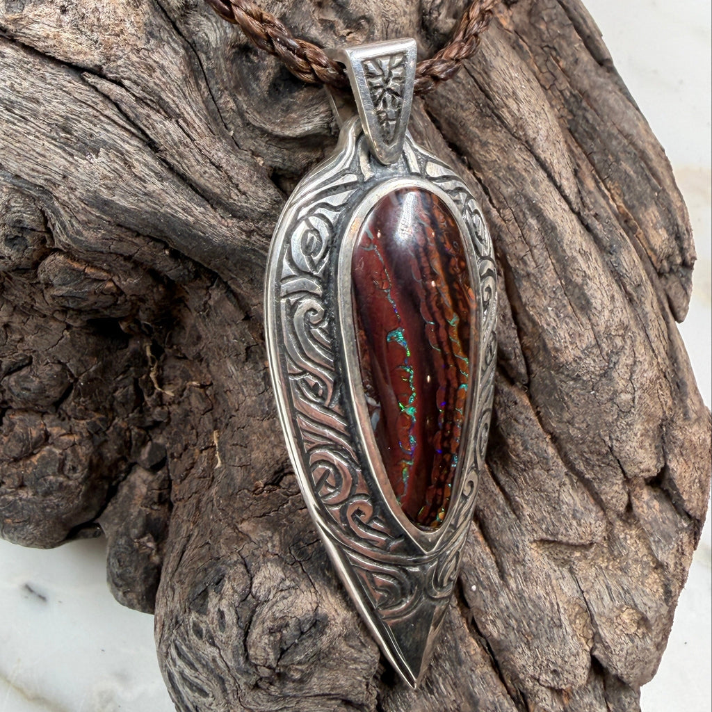 Tidal Koru Relic Boulder Opal Pendant, a one-of-a-kind boulder opal pendant inspired by the ancient Koru symbol of renewal, growth, and eternal movement.