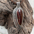 Tidal Koru Relic Boulder Opal Pendant, a one-of-a-kind boulder opal pendant inspired by the ancient Koru symbol of renewal, growth, and eternal movement.
