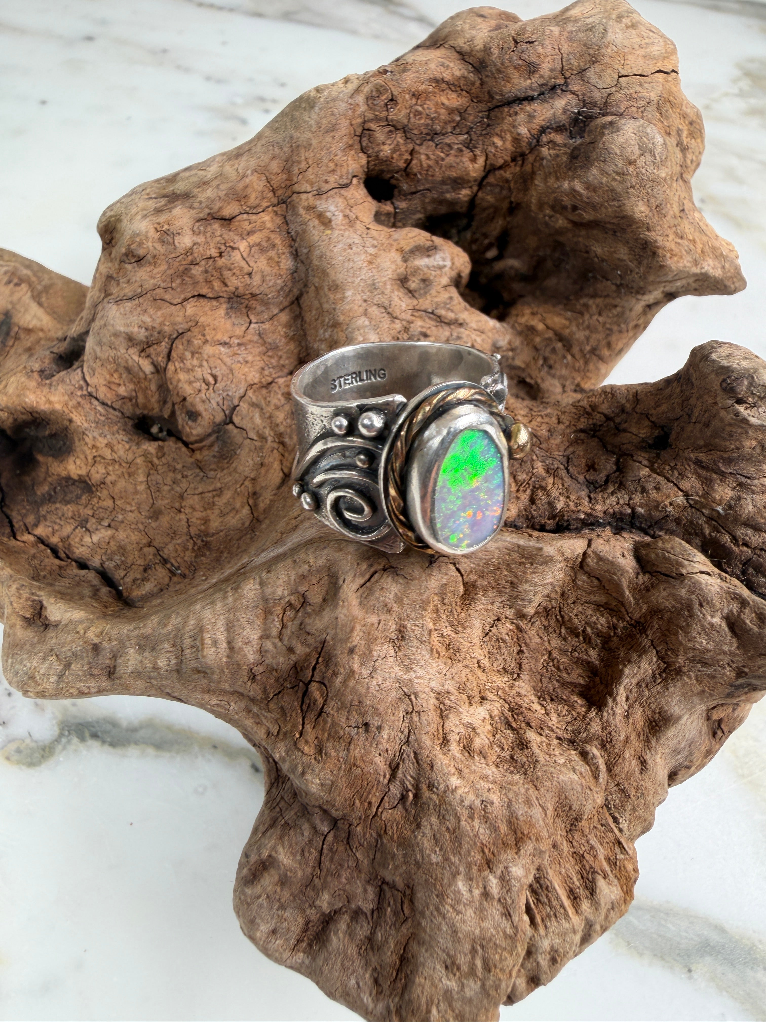 Sunlit Lagoon handcrafted Australian Coober Pedy opal ring in .925 sterling silver with a 14K gold rope bezel accent and gold accent ball.