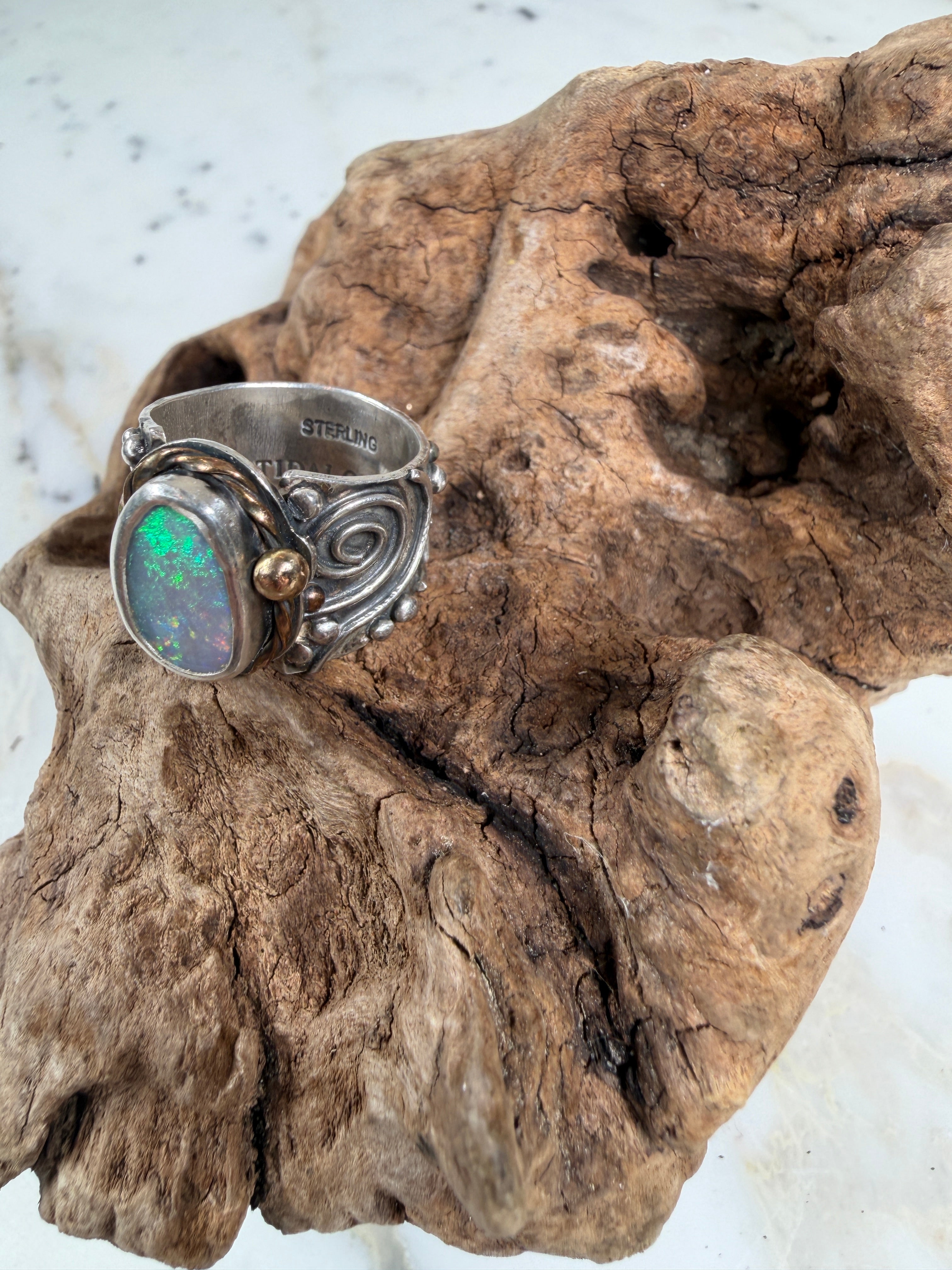 Sunlit Lagoon handcrafted Australian Coober Pedy opal ring in .925 sterling silver with a 14K gold rope bezel accent and gold accent ball.