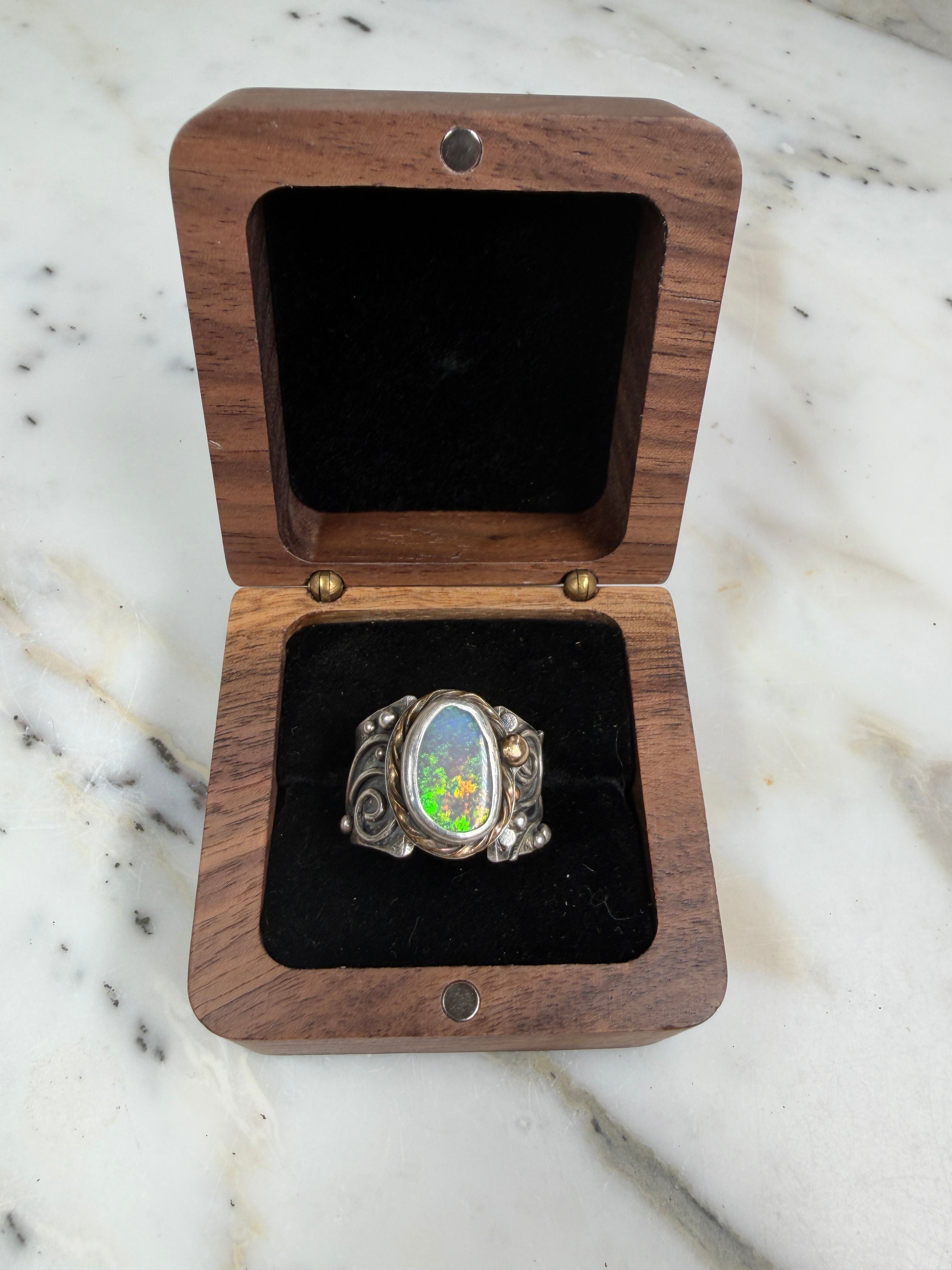 Sunlit Lagoon handcrafted Australian Coober Pedy opal ring in .925 sterling silver with a 14K gold rope bezel accent and gold accent ball.