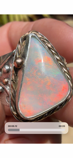 Celestial Tide handcrafted Australian crystal opal ring in .925 sterling silver with a 14K gold rope bezel, gold accents, and sculpted starfish.