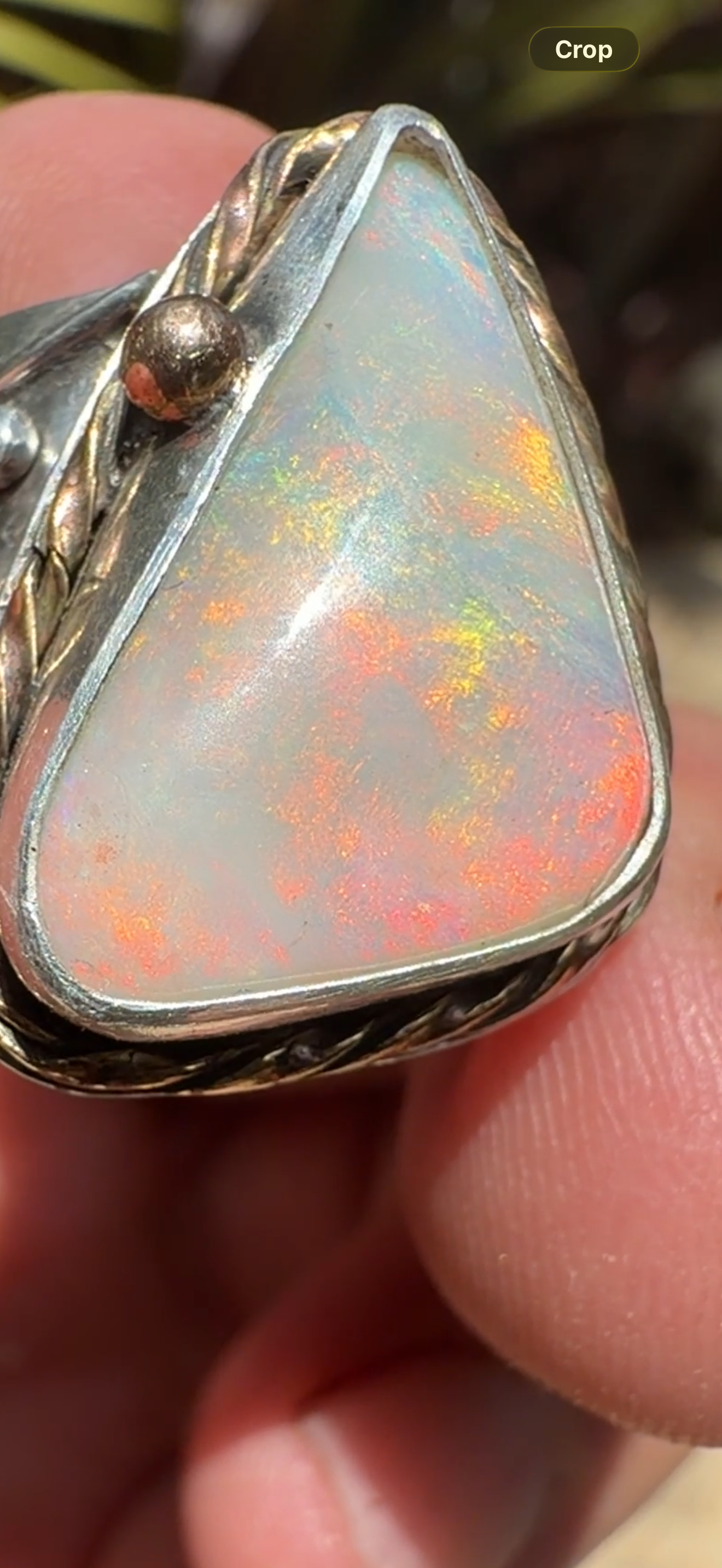 Celestial Tide handcrafted Australian crystal opal ring in .925 sterling silver with a 14K gold rope bezel, gold accents, and sculpted starfish.
