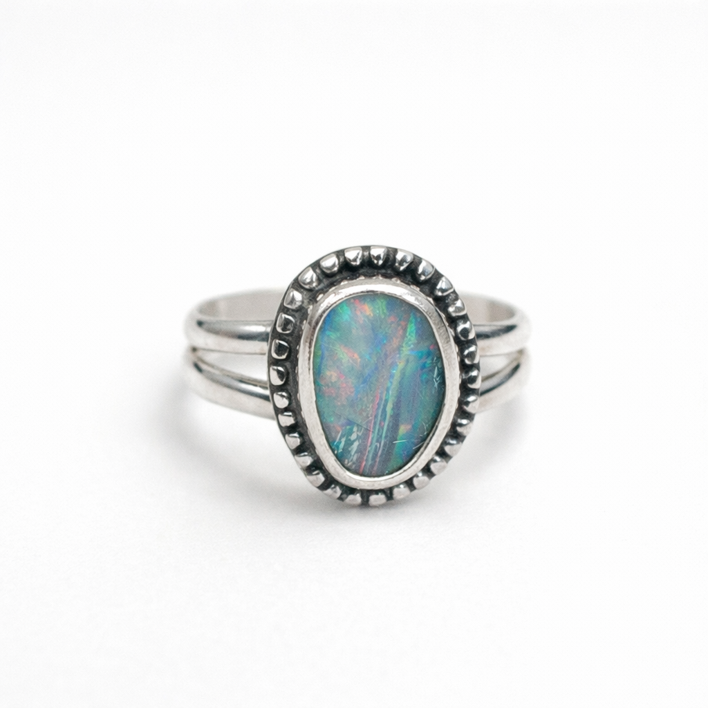 Silver ring with an oval opal stone
