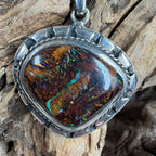 Sea Forge Australian Boulder Opal Pendant handcrafted in sterling silver featuring a genuine 20 × 24 mm Boulder Opal with brilliant blue, green, turquoise, and copper flashes.