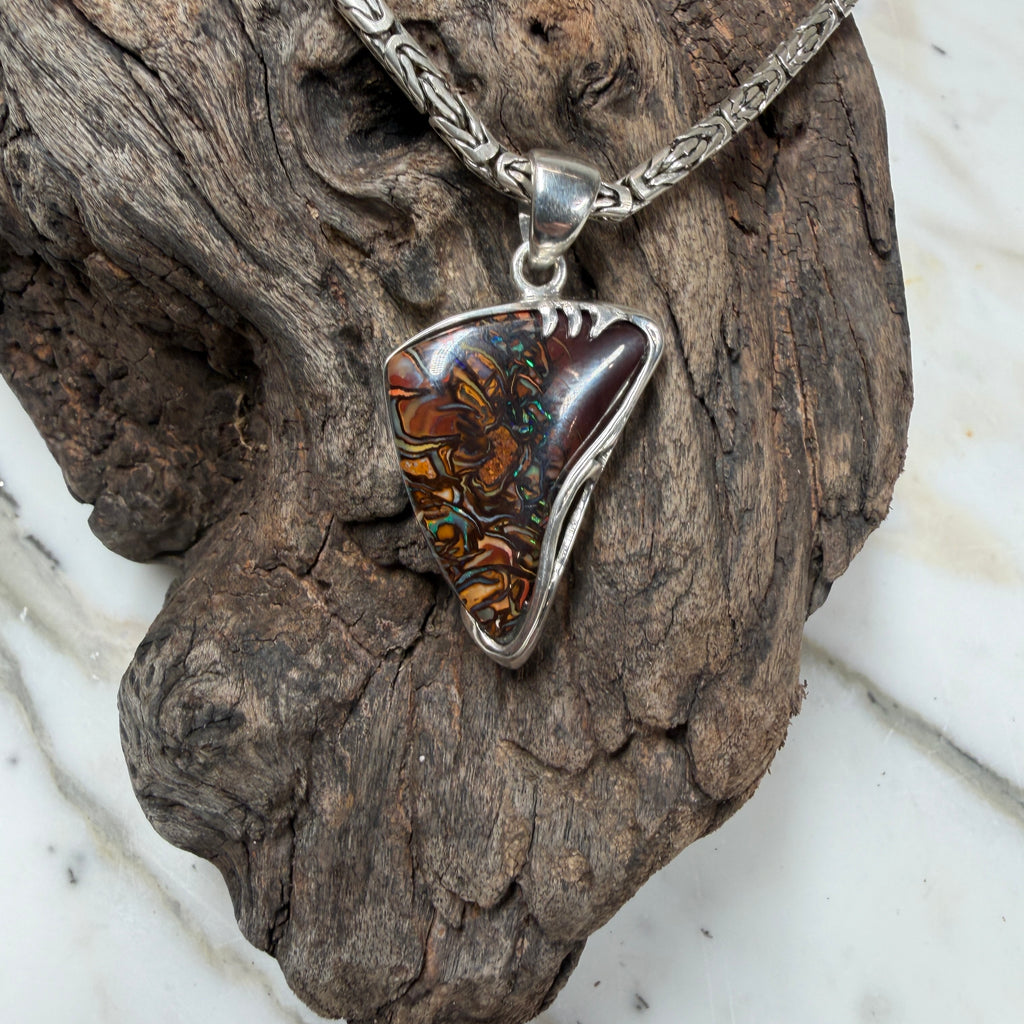 Silver pendant with a colorful stone 