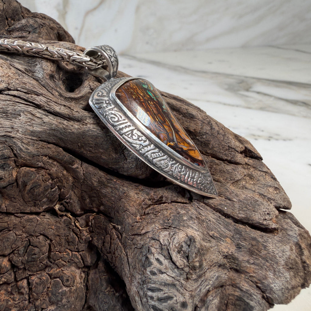 Unique artisan silver pendant with natural opal