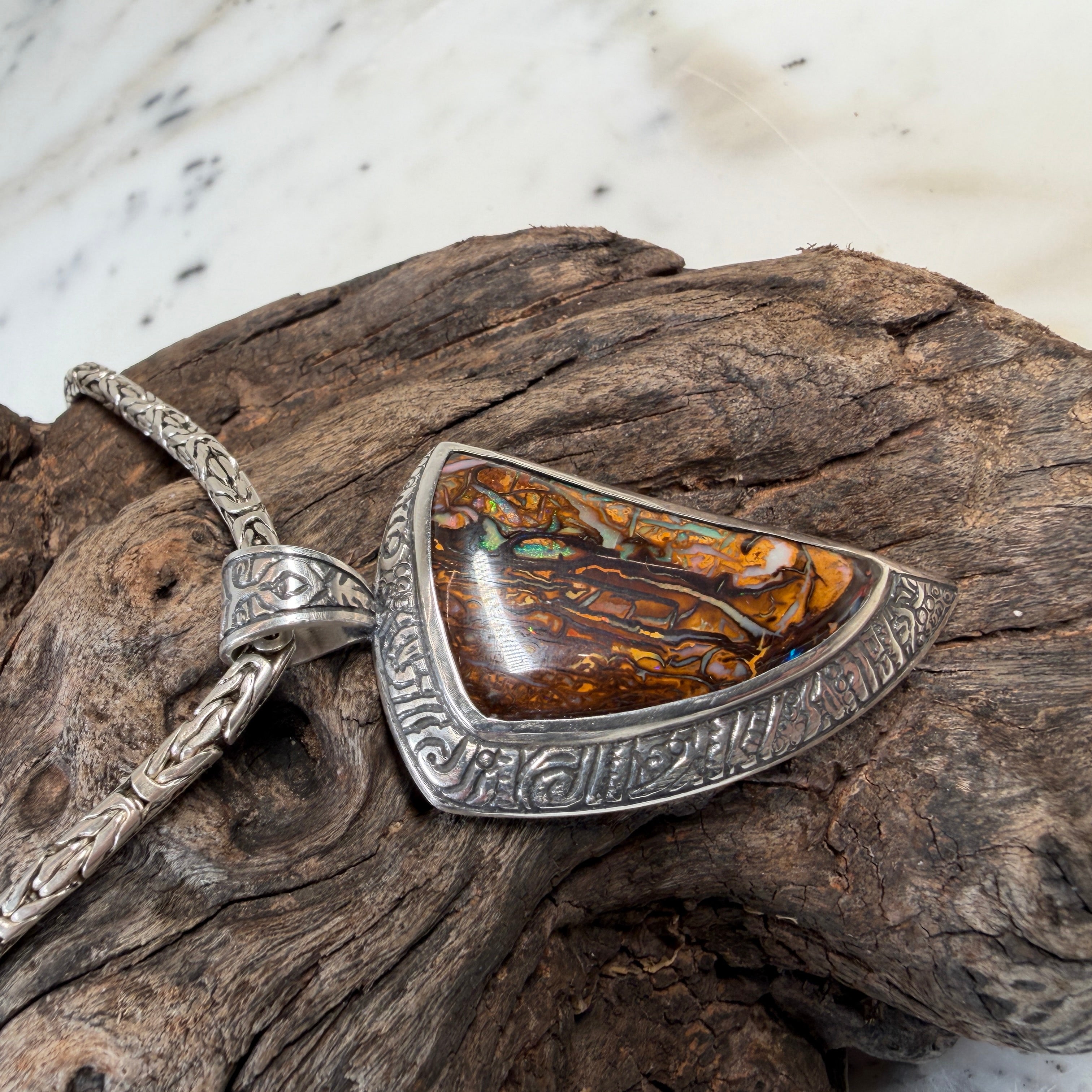 Australian opal pendant inspired by ocean waves