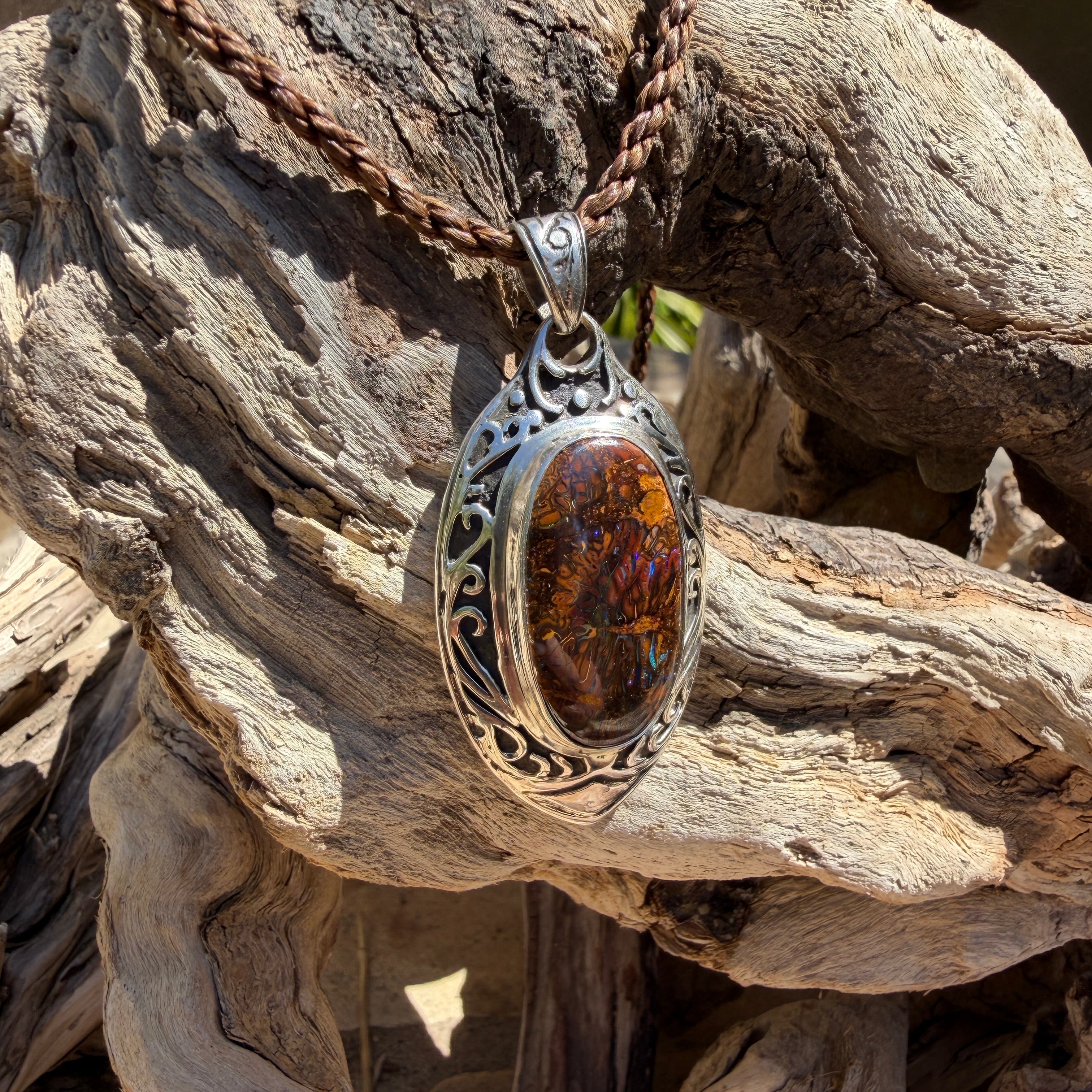 Australian Boulder Opal pendant rich bronze, chocolate, and blue natural colors.