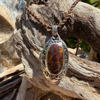 Luxury handcrafted Boulder Opal pendant in sterling silver reflecting the natural beauty of Australia's ancient inland seas.
