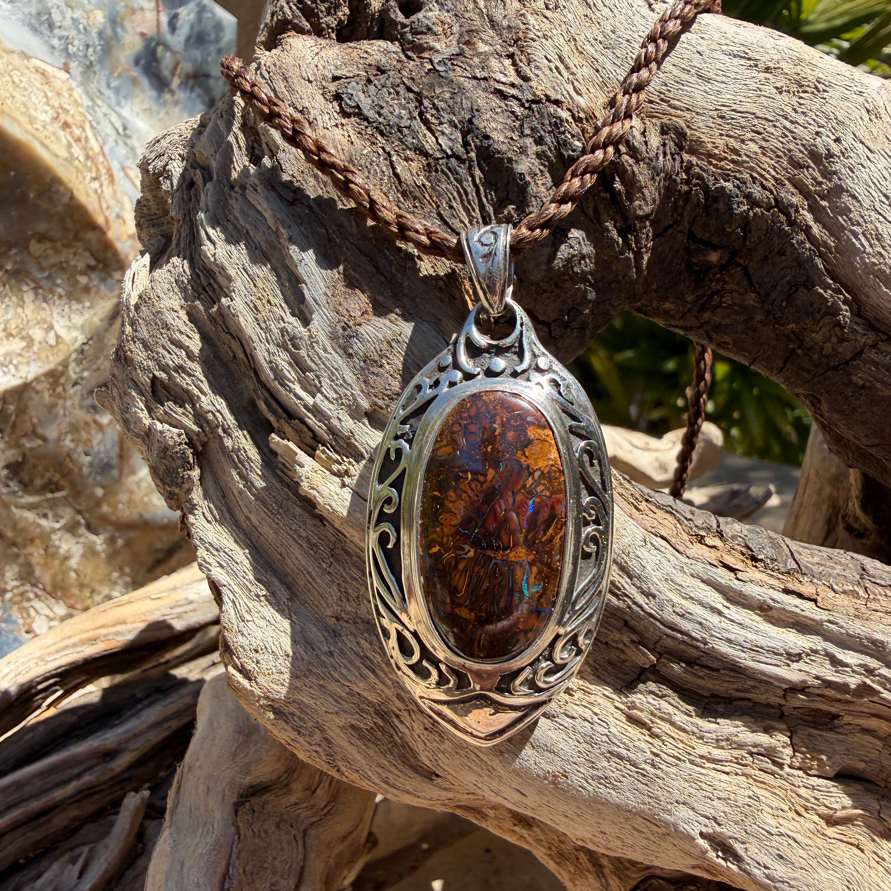 Luxury handcrafted Boulder Opal pendant in sterling silver reflecting the natural beauty of Australia's ancient inland seas.