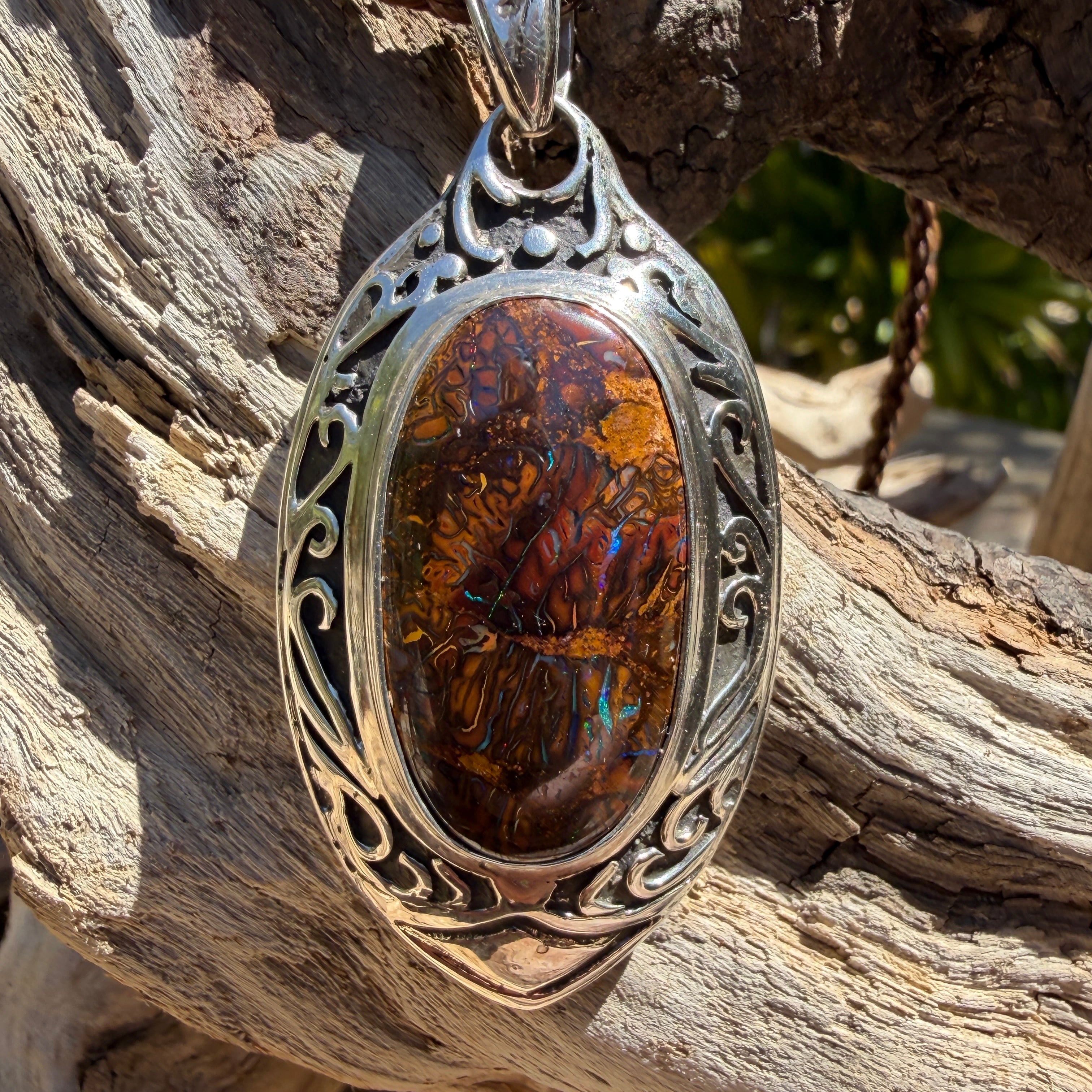 Ancient Current one-of-a-kind Australian Boulder Opal pendant handcrafted exclusively for TIDAL OPALS with sterling silver setting.