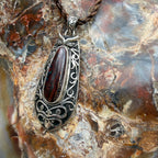 One-of-a-kind Ironwood Ember pendant with genuine Australian Boulder Opal, oxidized sterling silver, and Māori-inspired craftsmanship.