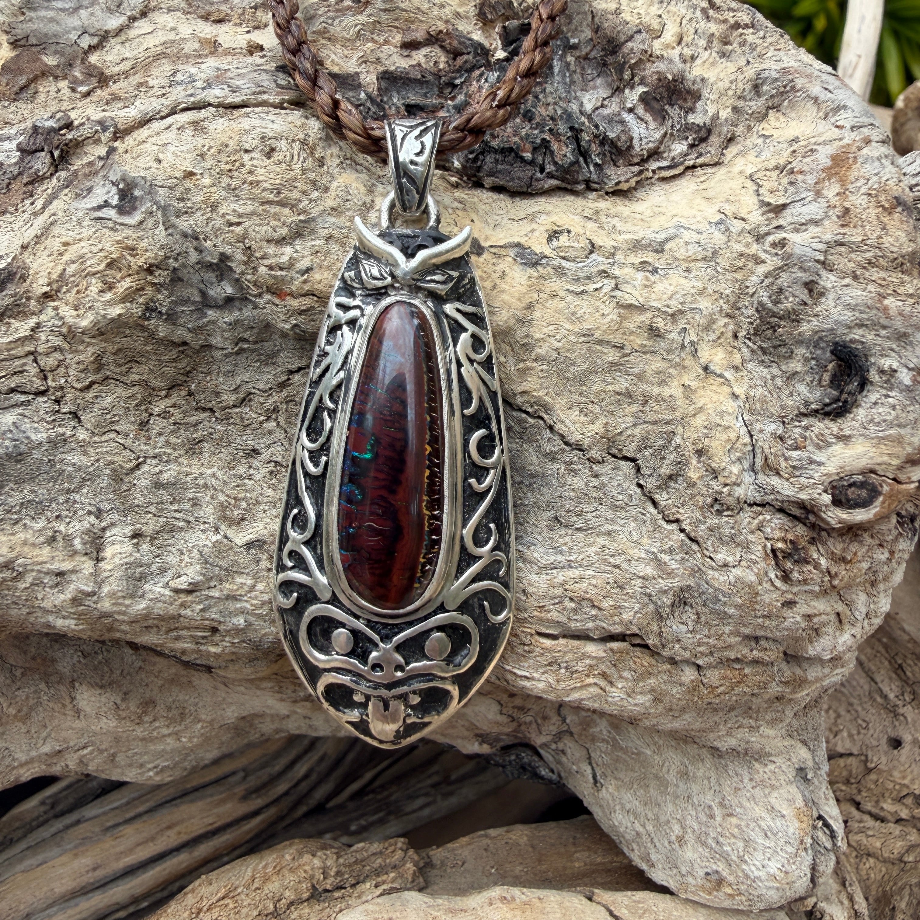 One-of-a-kind Ironwood Ember pendant with genuine Australian Boulder Opal, oxidized sterling silver, and Māori-inspired craftsmanship.