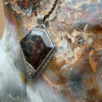 Artisan sterling silver pendant featuring a unique Australian Boulder Opal centerpiece.