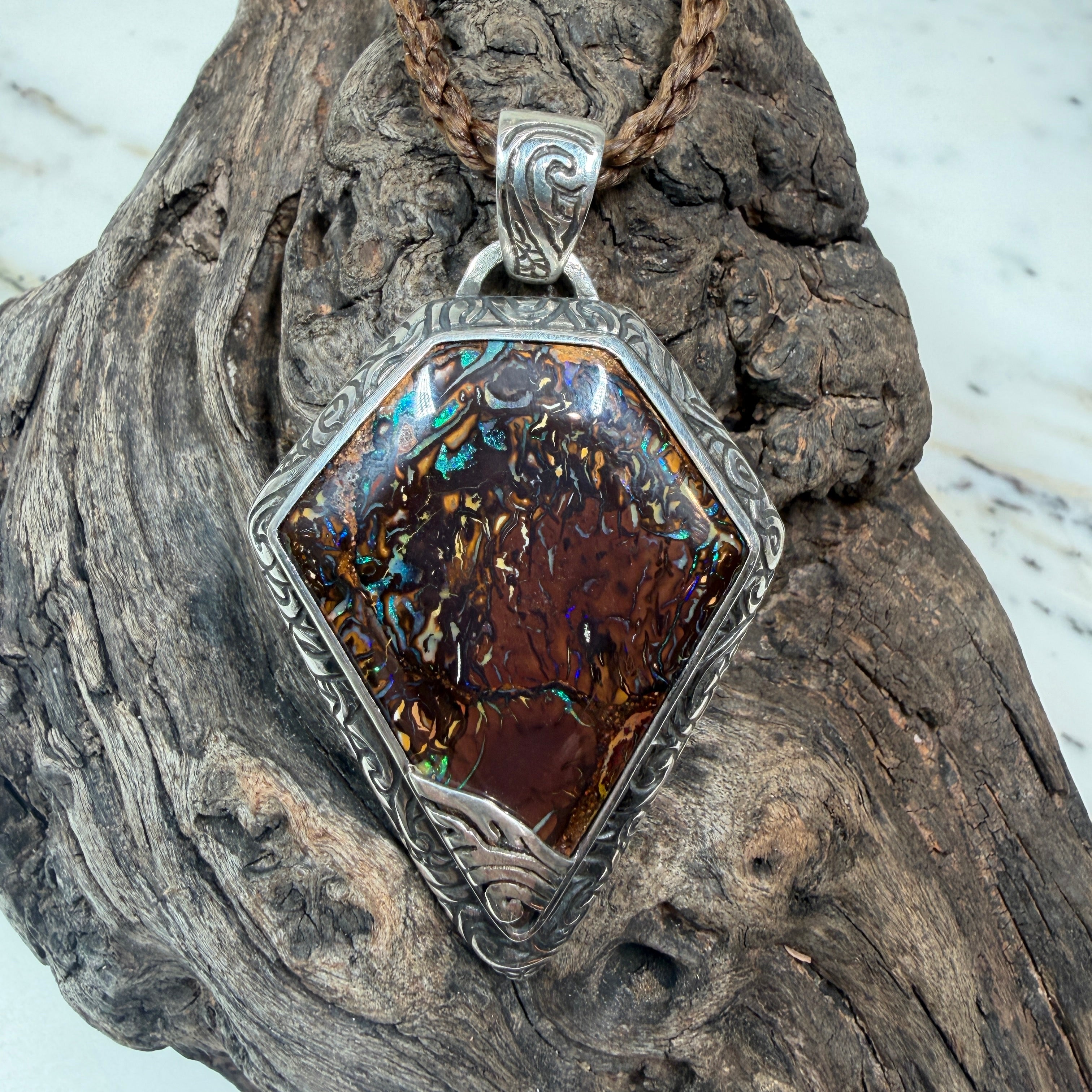 Ancient Veil is a one-of-a-kind Australian Boulder Opal pendant