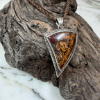 Handcrafted sterling silver pendant with a genuine Australian Boulder Opal inspired by weathered driftwood.