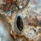 One-of-a-kind Australian Boulder Opal pendant featuring natural blue and green color play in ironstone.