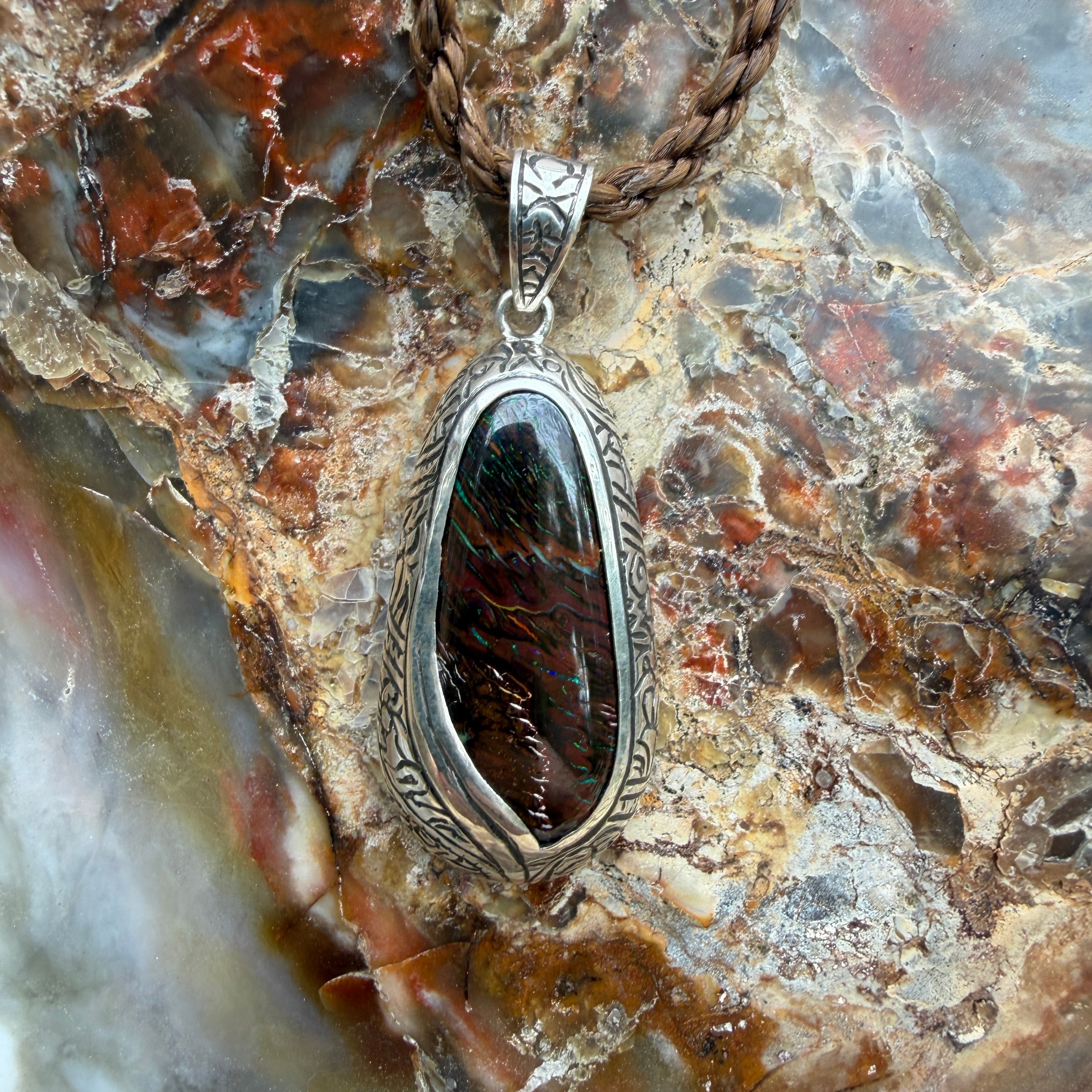 One-of-a-kind Australian Boulder Opal pendant featuring natural blue and green color play in ironstone.