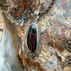 Handcrafted sterling silver pendant featuring a natural Boulder Opal inspired by Polynesian wayfinding.