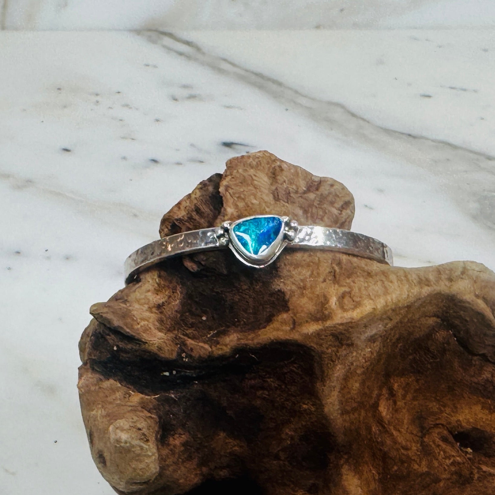 .925 Sterling Silver hammered cuff with blue and green Australian Boulder Opal stone. 