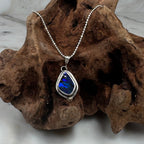 Silver necklace with a blue pendant 