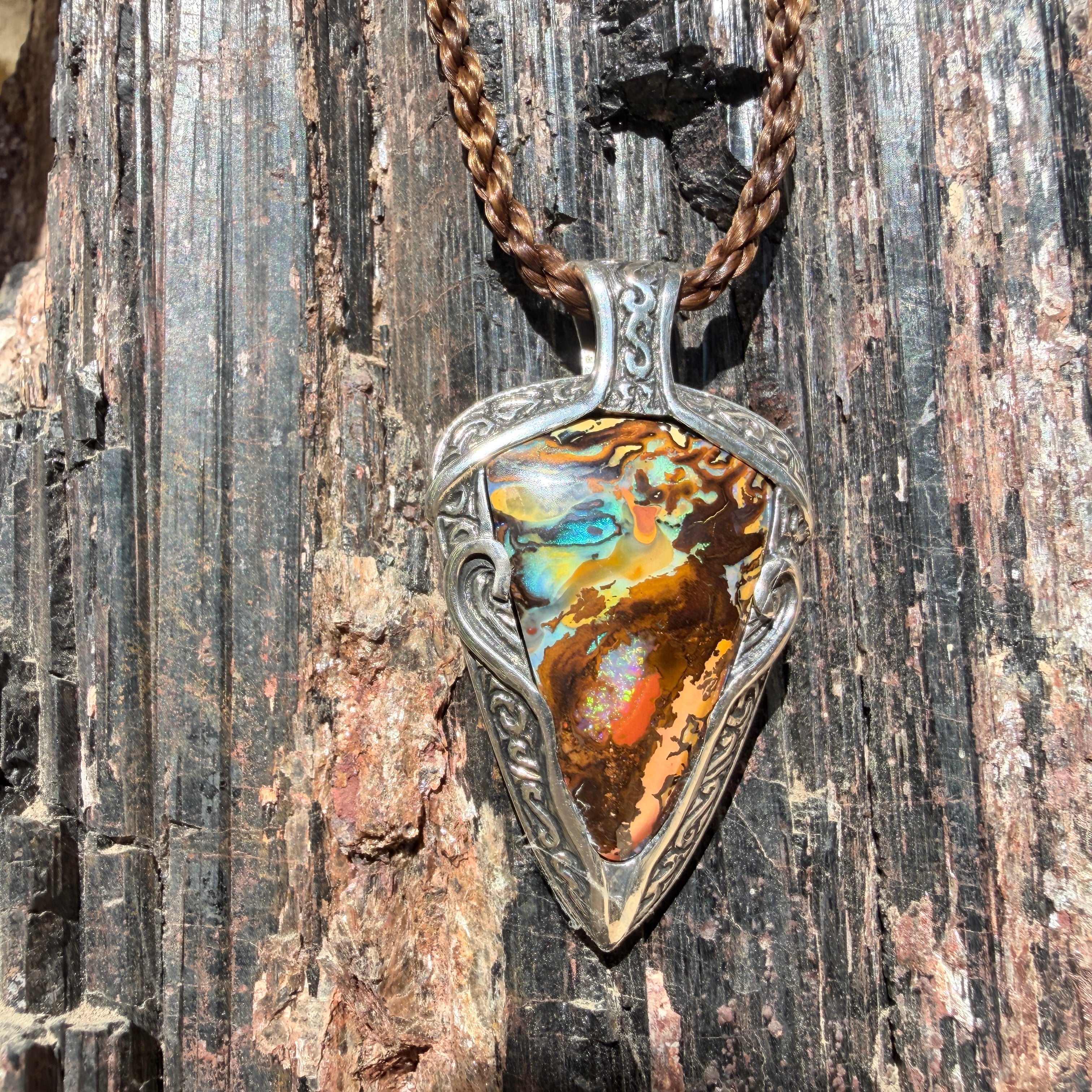 Ocean Current one-of-a-kind Australian Boulder Opal pendant handcrafted in solid .950 silver featuring vivid turquoise, blue, green, orange, gold, and natural Australian ironstone.