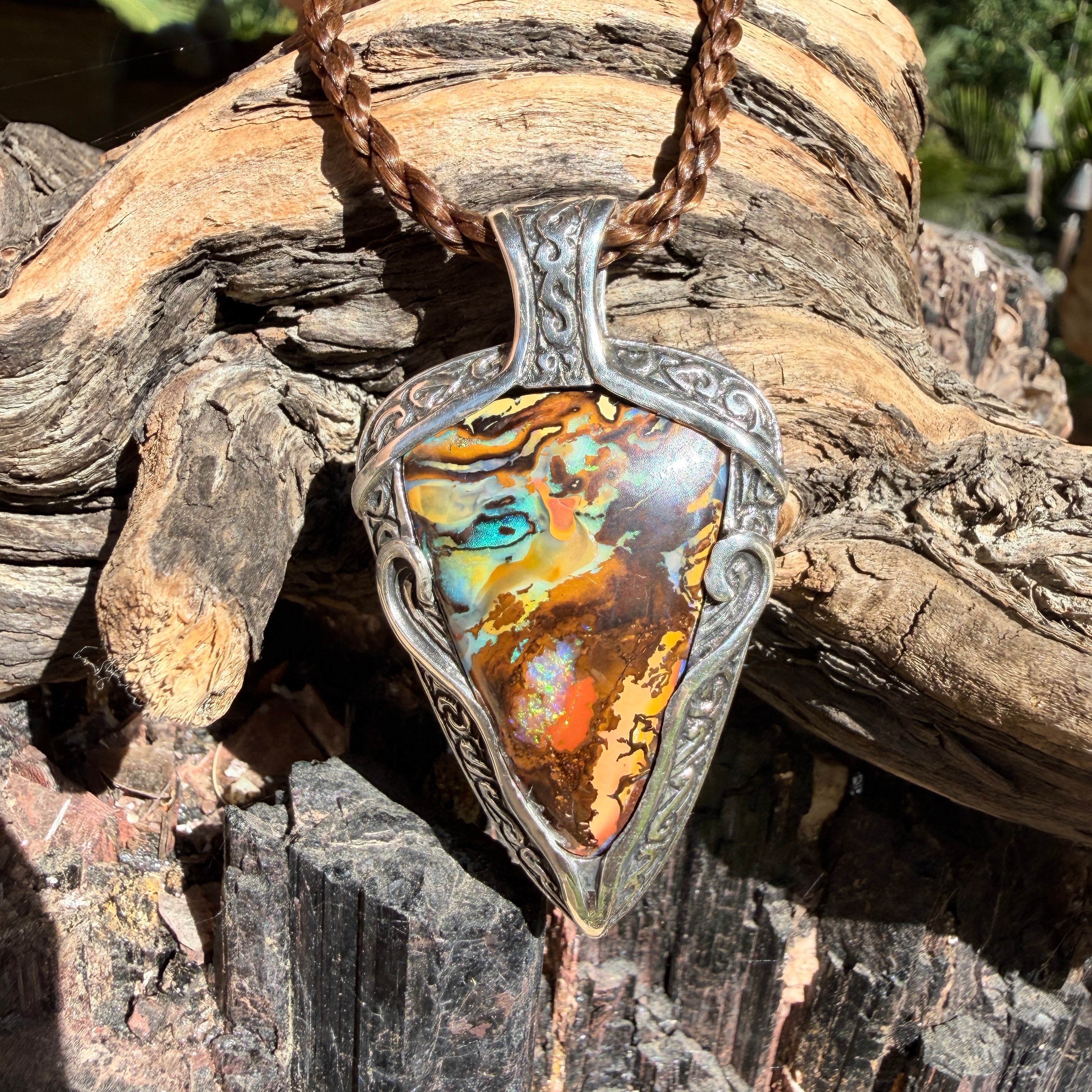Ocean Current one-of-a-kind Australian Boulder Opal pendant handcrafted in solid .950 silver featuring vivid turquoise, blue, green, orange, gold, and natural Australian ironstone.