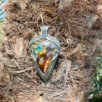 Ocean Current one-of-a-kind Australian Boulder Opal pendant handcrafted in solid .950 silver featuring vivid turquoise, blue, green, orange, gold, and natural Australian ironstone.