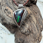 One-of-a-kind Australian Boulder Opal pendant in sterling silver with engraved ancient-inspired detailing.