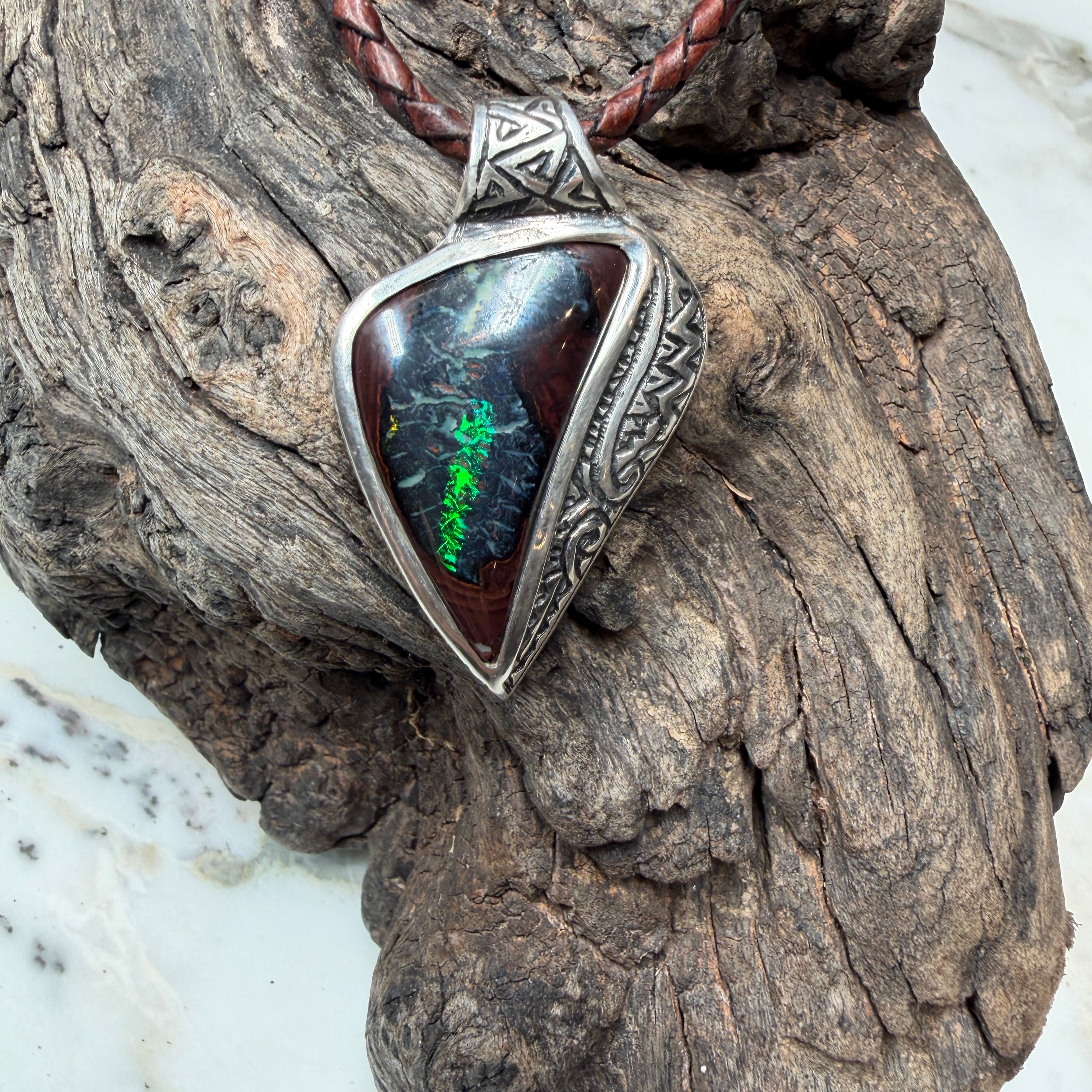 One-of-a-kind Australian Boulder Opal pendant in sterling silver with engraved ancient-inspired detailing.