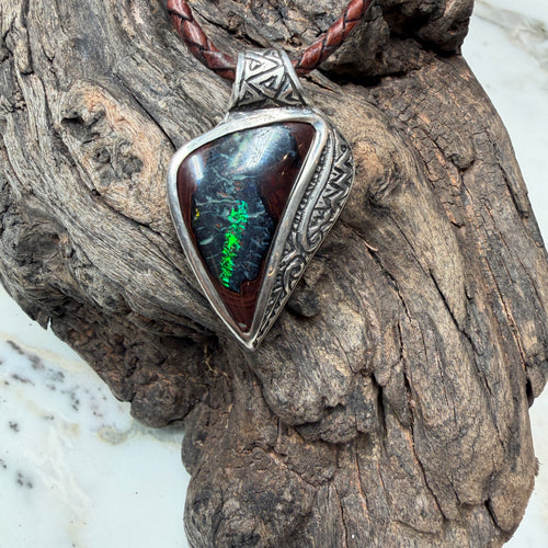 One-of-a-kind Australian Boulder Opal pendant in sterling silver with engraved ancient-inspired detailing.