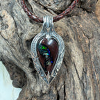 Handmade Australian Boulder Opal pendant with vivid emerald green, teal, and golden flashes in polished .925 sterling silver.