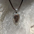 Ancient Tide one-of-a-kind Australian Boulder Opal pendant handcrafted in solid .950 silver by TIDAL OPALS, featuring a natural 31 x 18 mm boulder opal with blue, teal, green, violet, and gold play-of-color, hand-engraved details, and an intricate hand-pierced backplate.