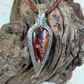 Ember Relic one-of-a-kind Australian boulder opal pendant with electric blue, orange and red color set in engraved sterling silver.