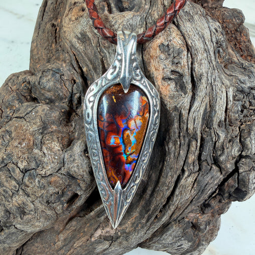 Ember Relic one-of-a-kind Australian boulder opal pendant with electric blue, orange and red color set in engraved sterling silver.